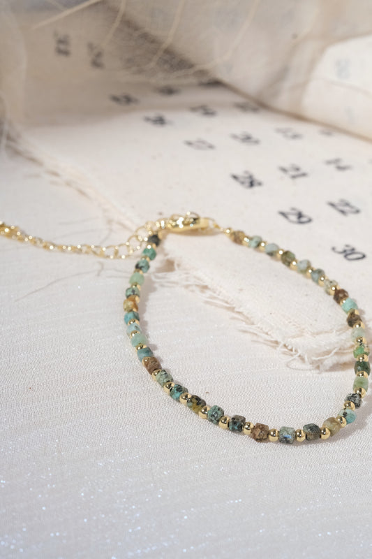 Green Gold Tone Patterned Spacers Bracelet — real product photo
