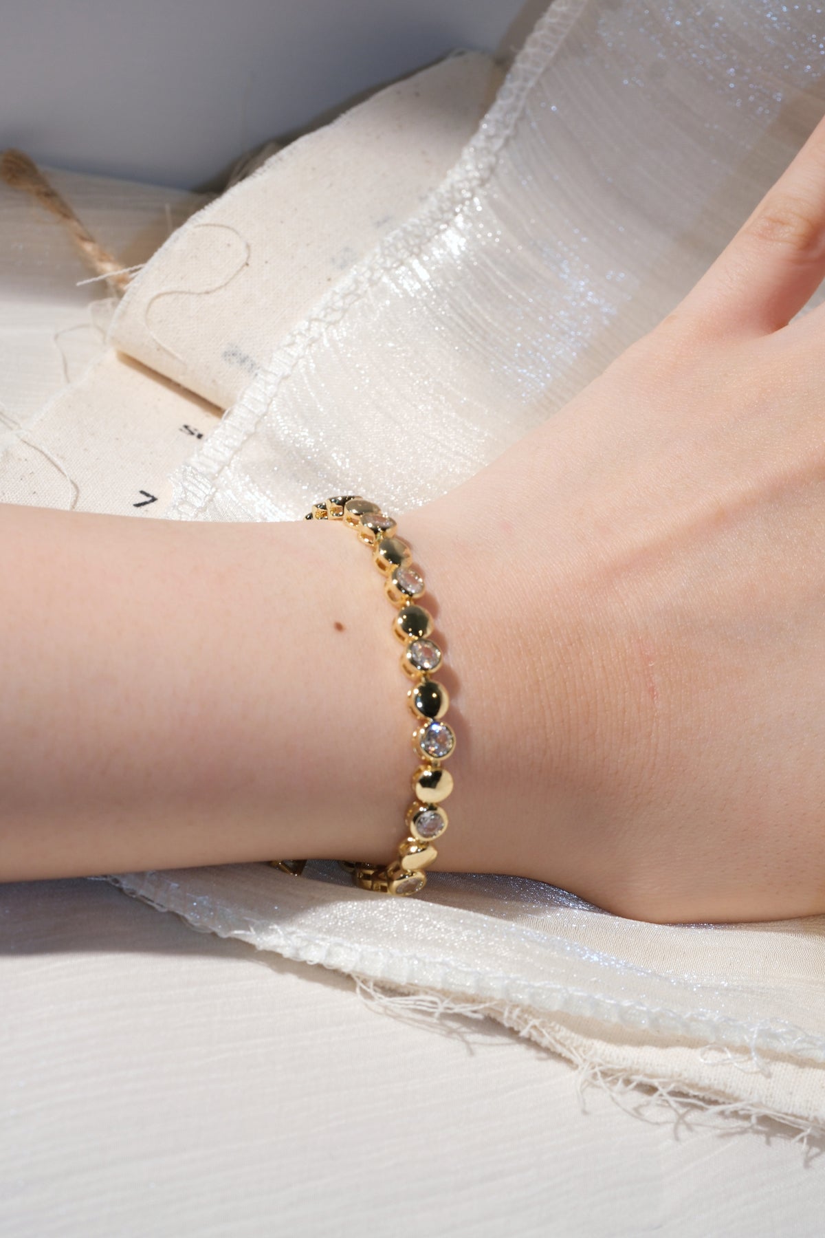 CZ and Disc Station Bracelet — Gold — edited real product photo