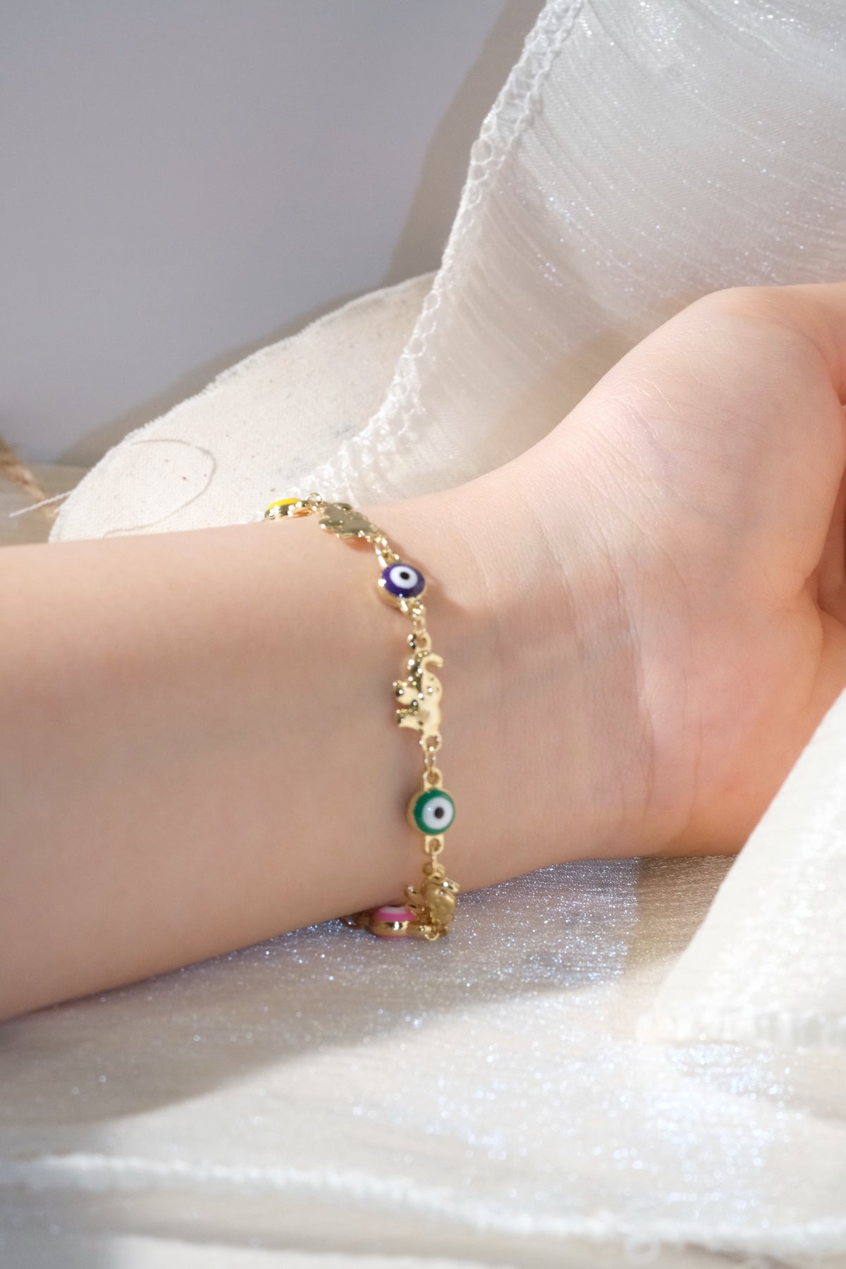 Colorful Eye and Elephant Bracelet — Gold — edited real product photo