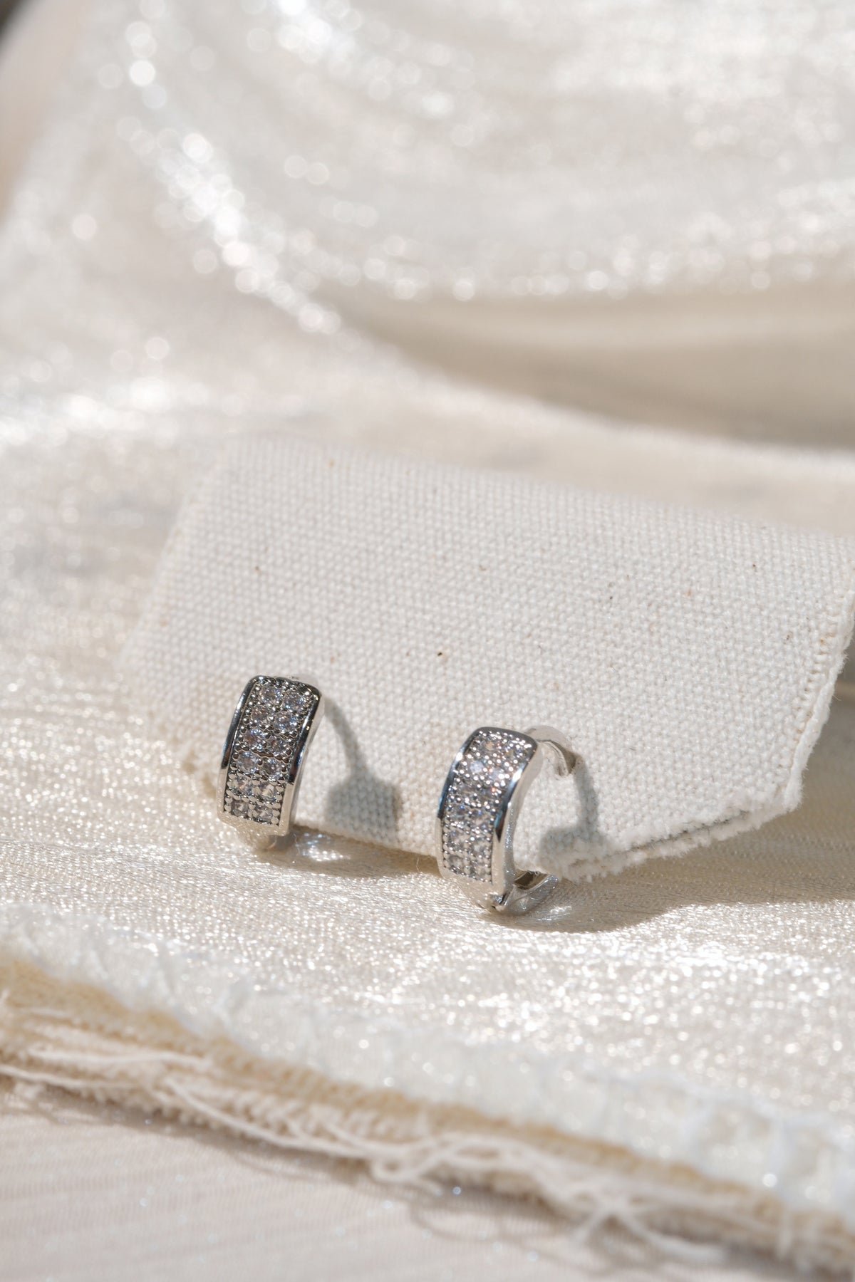 Wide Pave Huggies — Silver — edited real product photo