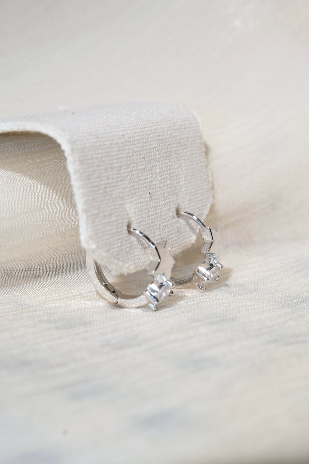 Star Accent CZ Hoops — Silver — edited real product photo