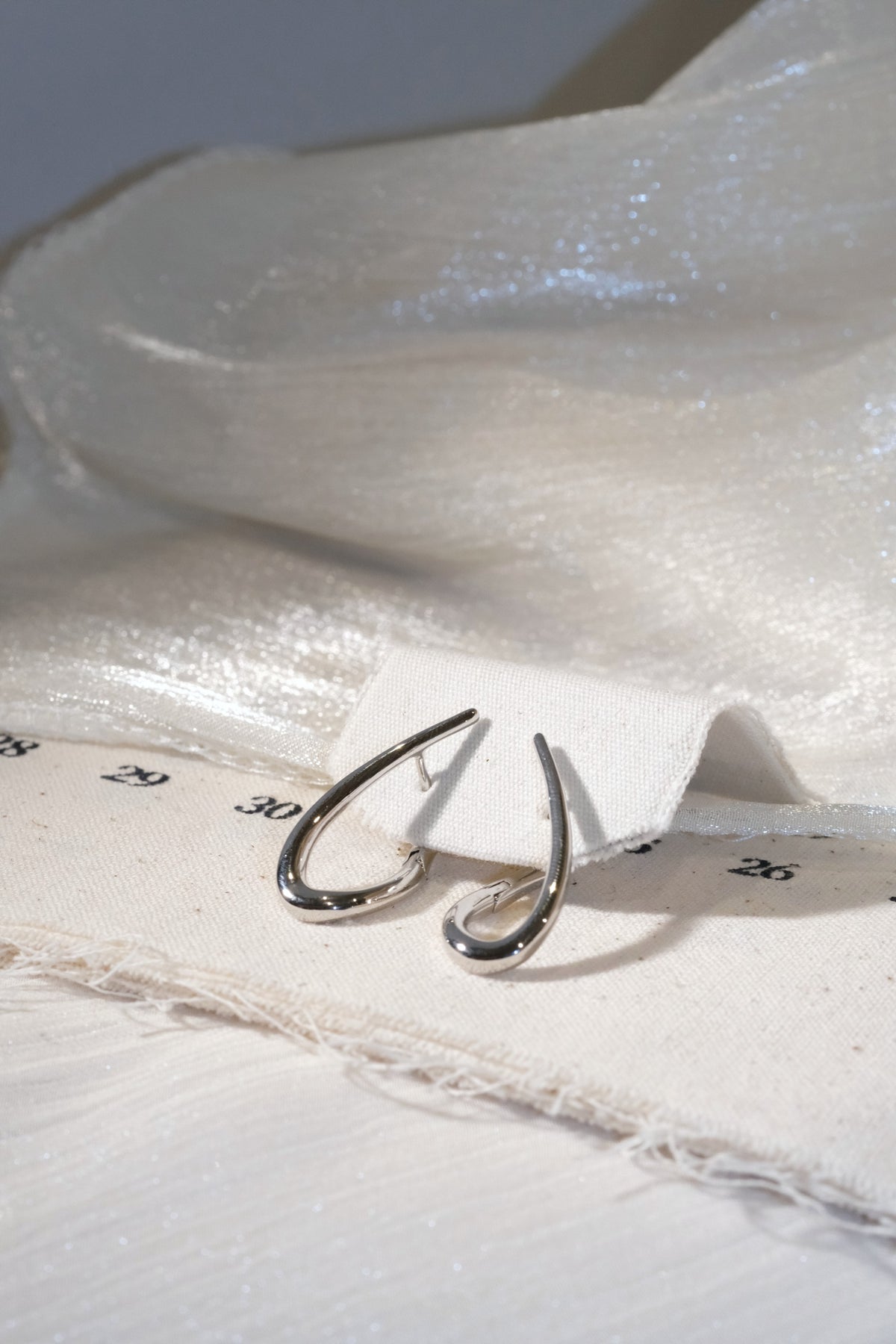Teardrop Hoop Earrings — Silver — edited real product photo