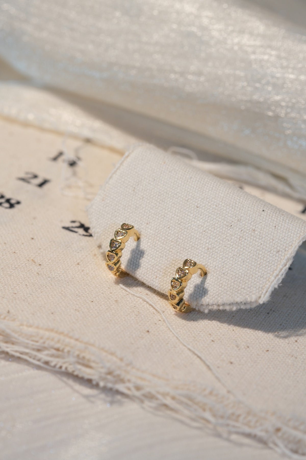 Heart Bezel CZ Hoop Earrings — Gold — real-life photo