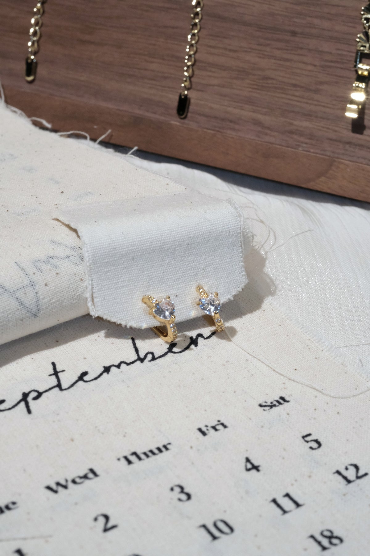Three Stone CZ Huggie Earrings — Gold