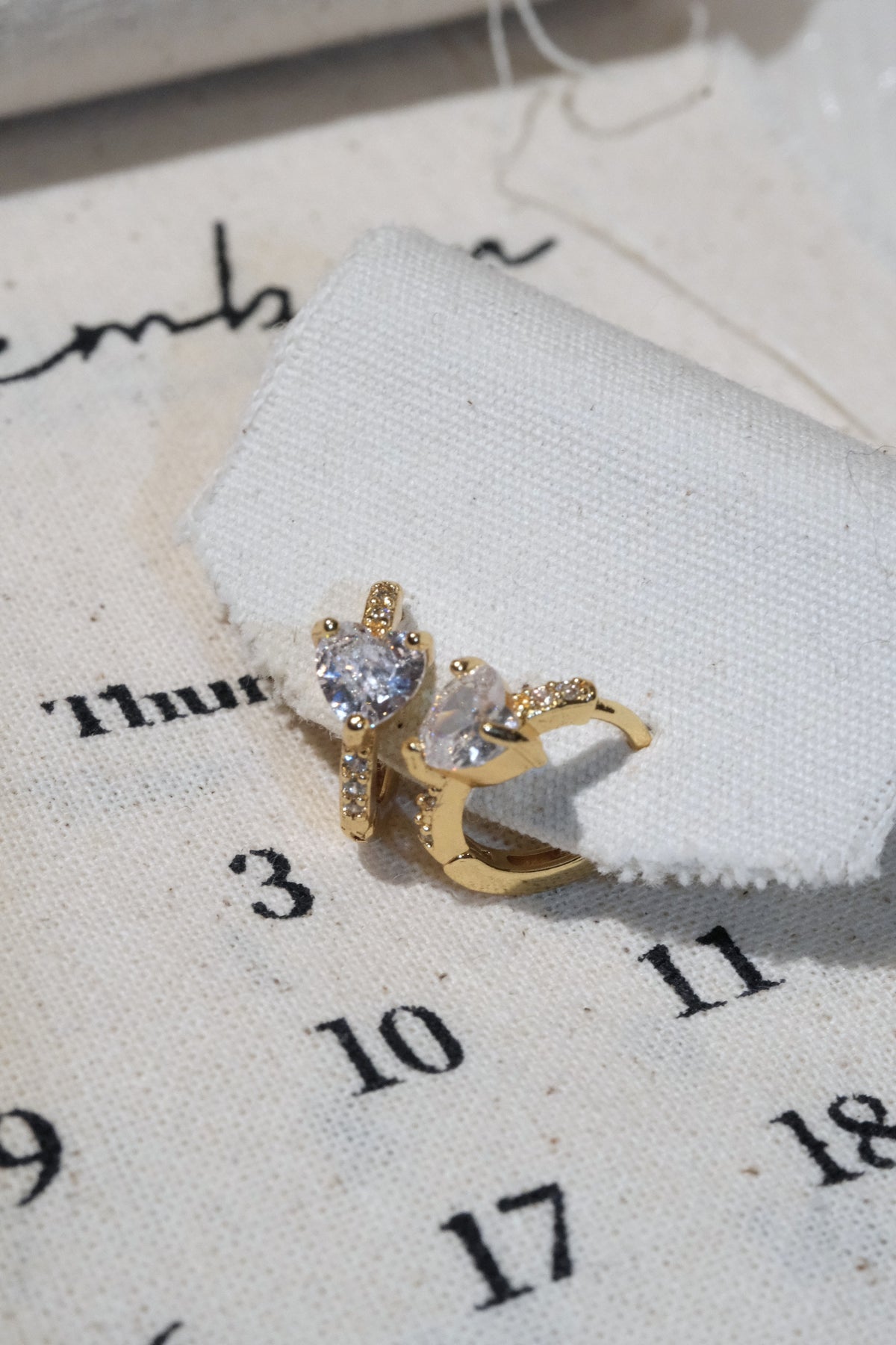 Three Stone CZ Huggie Earrings — Gold