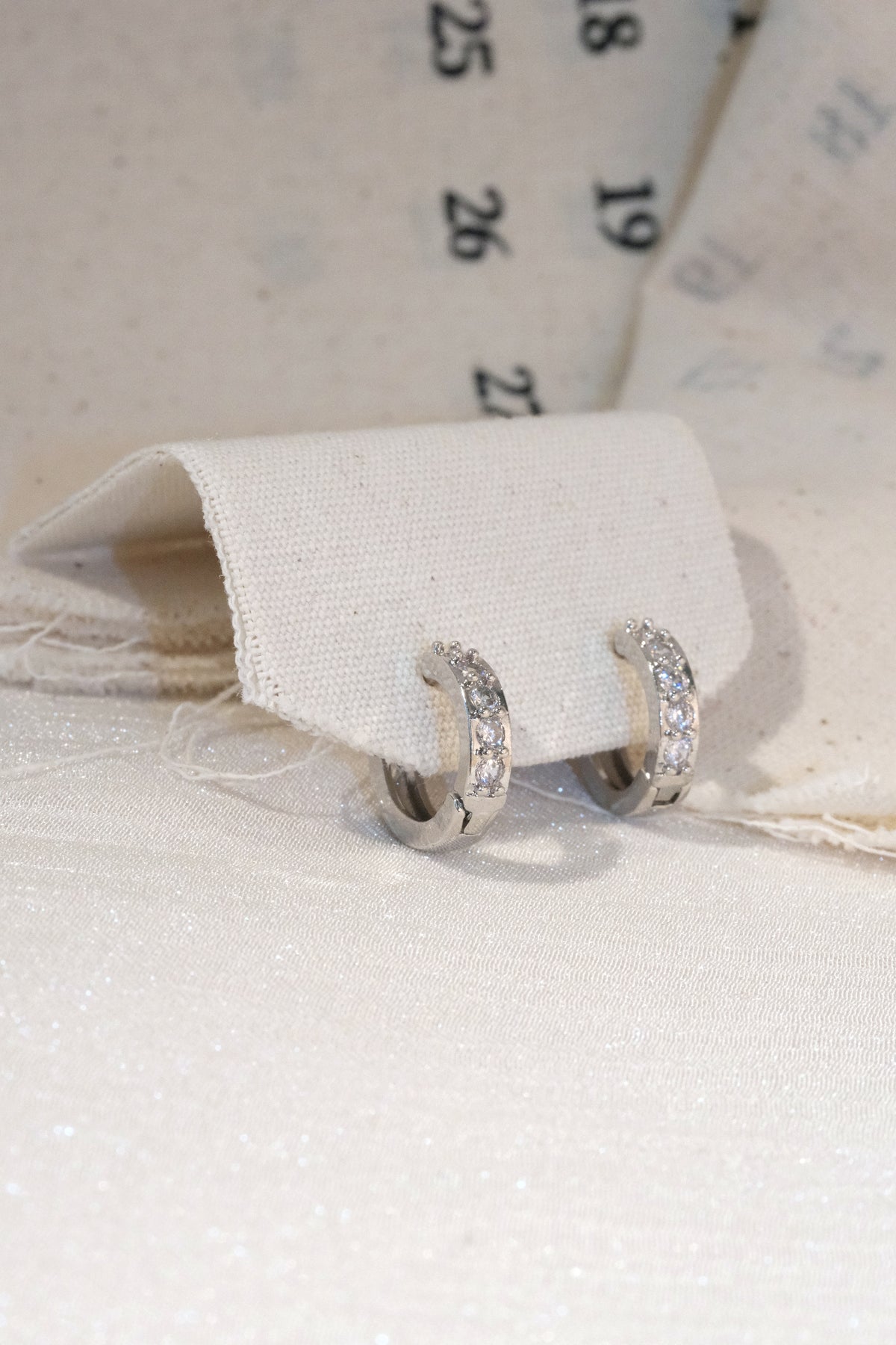 Five Stone CZ Huggie Earrings — Silver