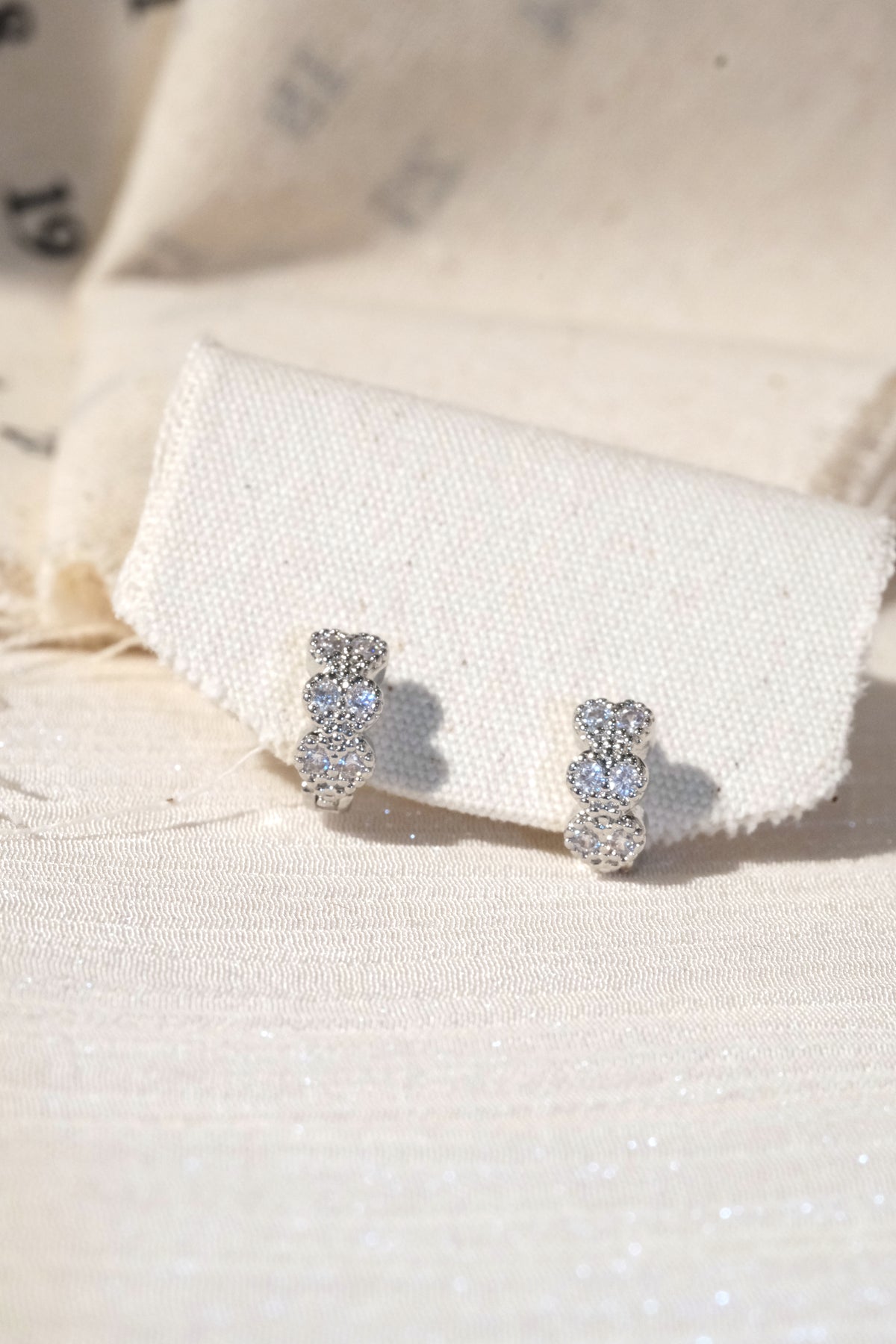 Petal CZ Huggie Earrings — Silver