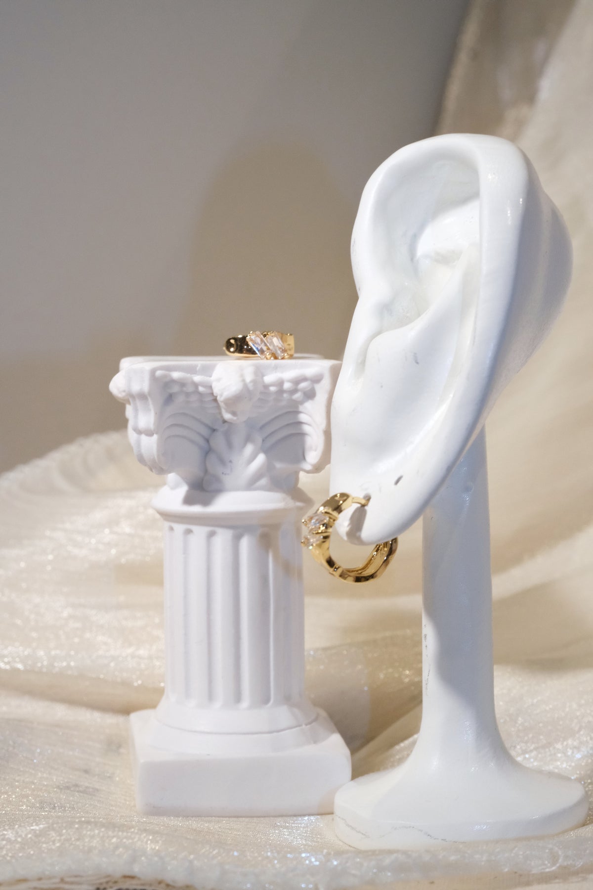 Offset Baguette CZ Huggie Earrings — Gold — edited real product photo