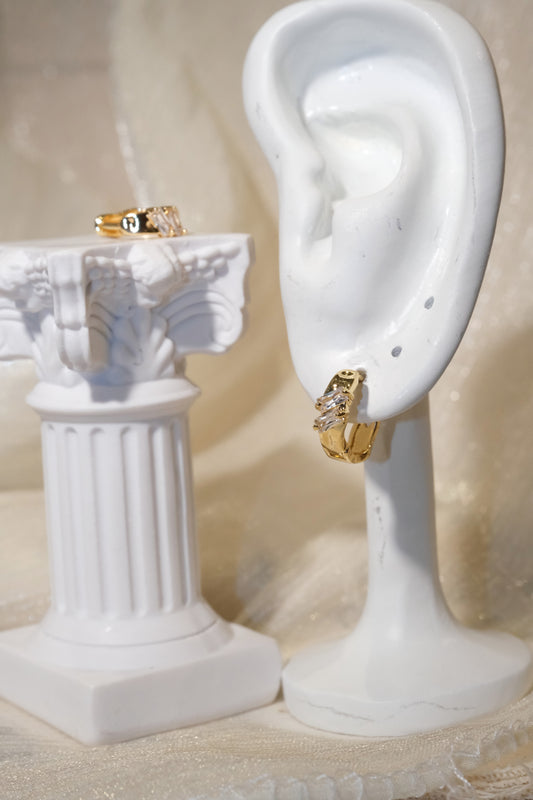Offset Baguette CZ Huggie Earrings — Gold — edited real product photo
