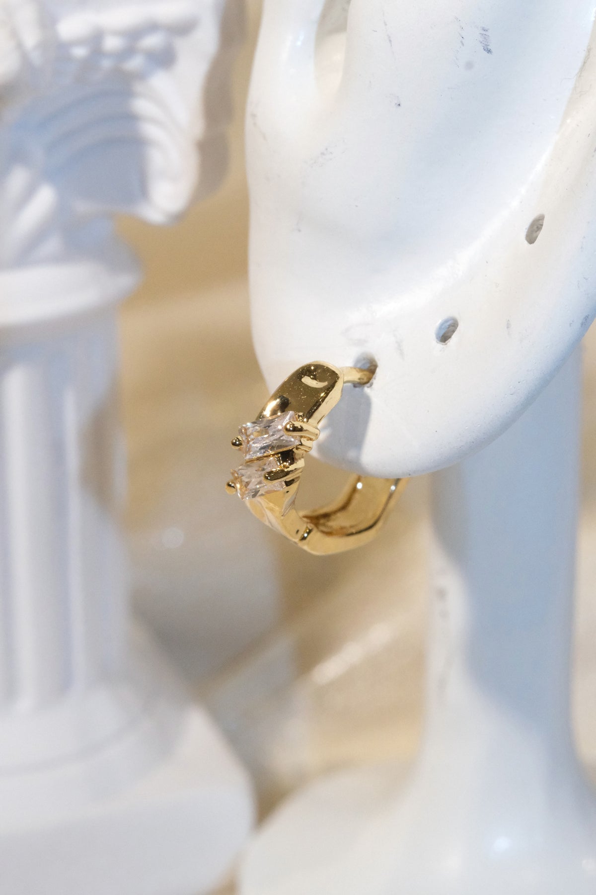 Offset Baguette CZ Huggie Earrings — Gold — edited real product photo