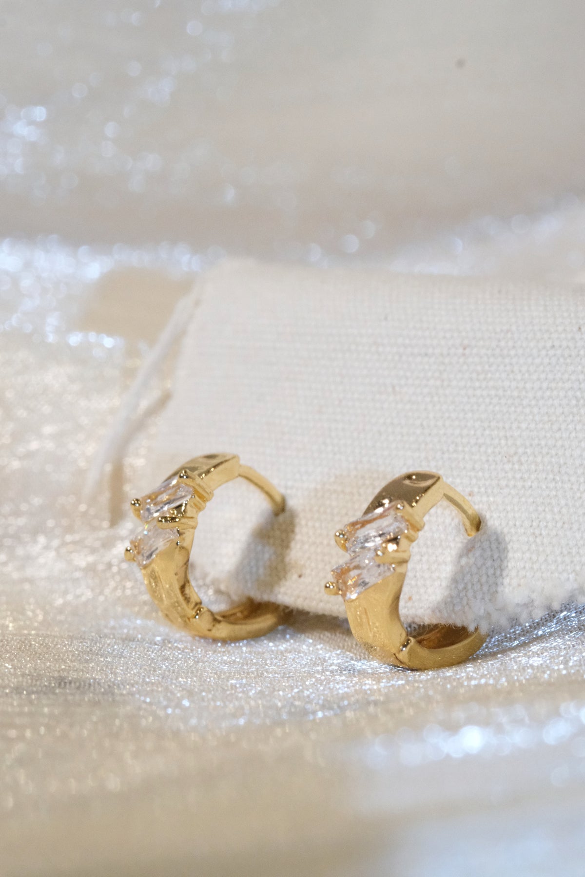 Offset Baguette CZ Huggie Earrings — Gold — edited real product photo