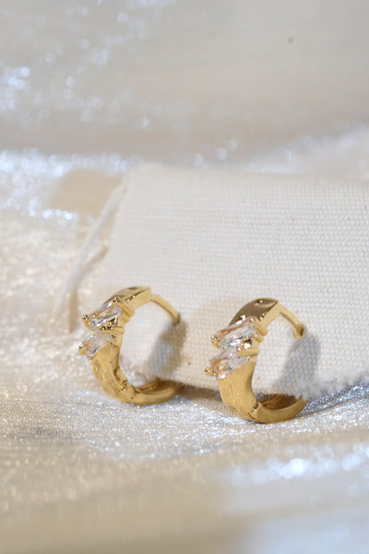 Offset Baguette CZ Huggie Earrings — Gold — edited real product photo