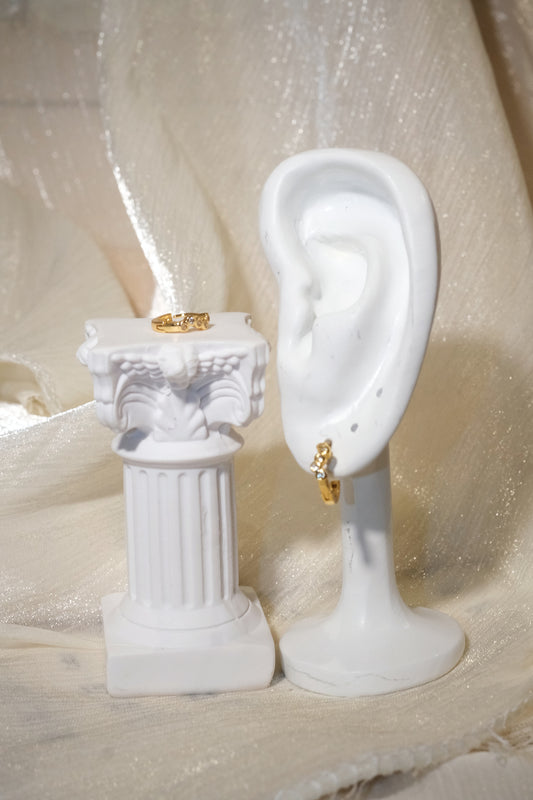 Five-Stone Bezel CZ Huggie Earrings — Gold — edited real product photo