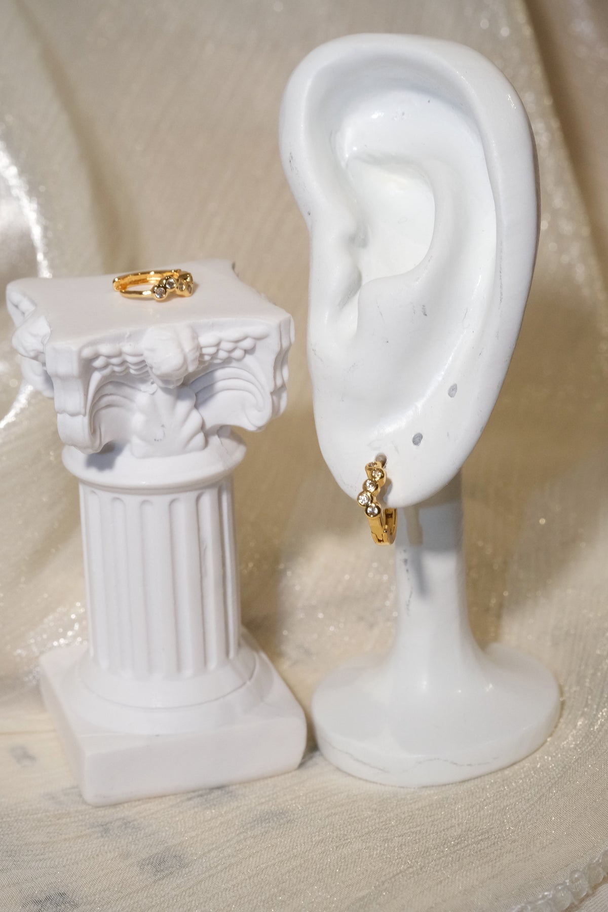 Five-Stone Bezel CZ Huggie Earrings — Gold — edited real product photo