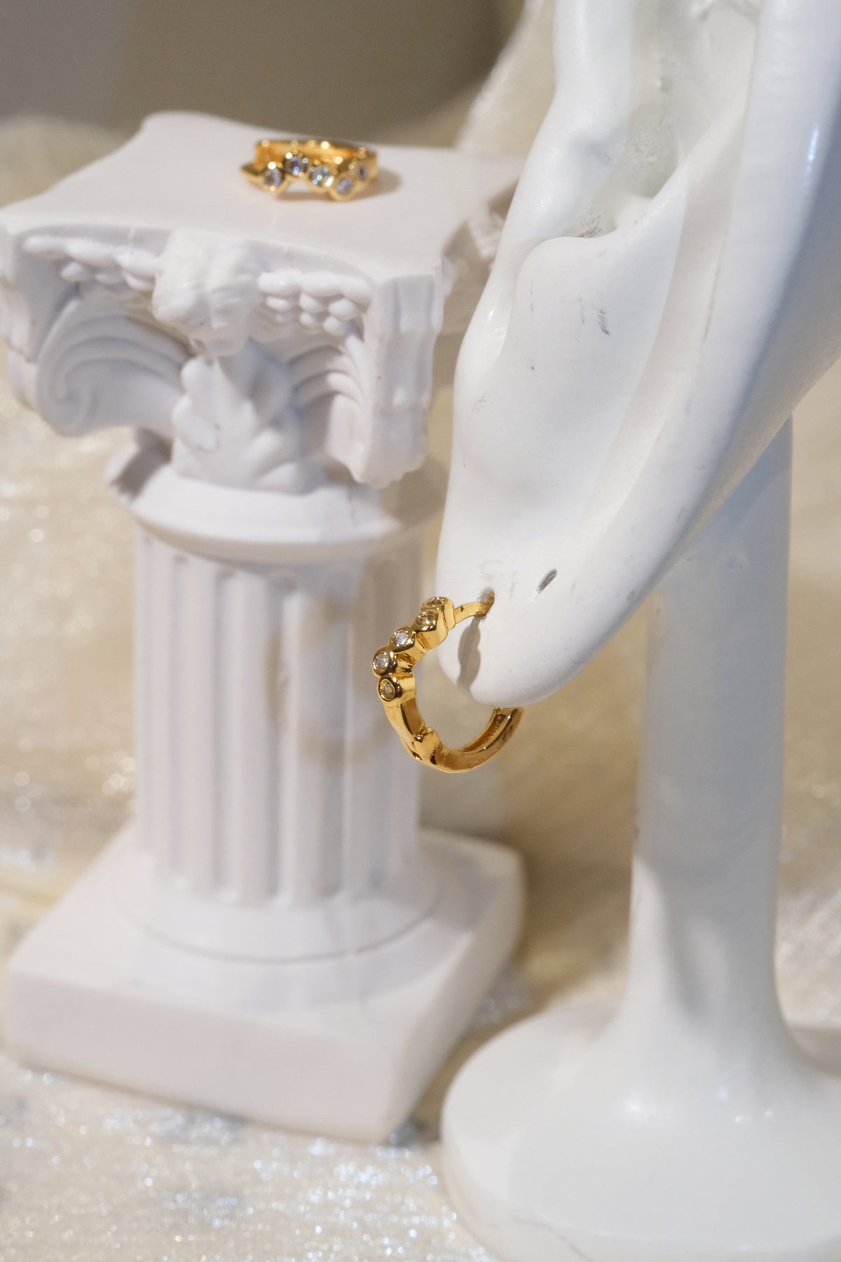 Five-Stone Bezel CZ Huggie Earrings — Gold — edited real product photo