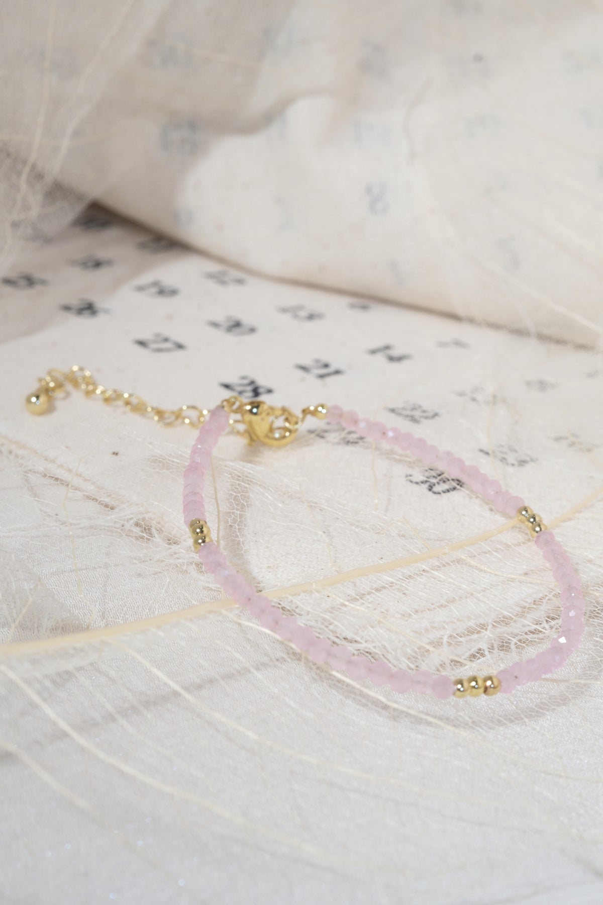 Pink Faceted Gold Tone Accent Bracelet — real product photo