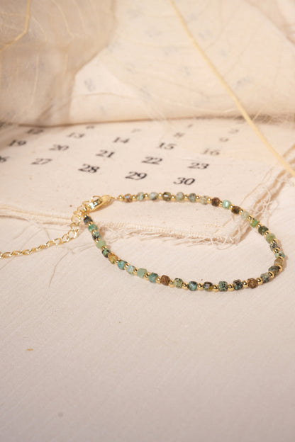 Green Gold Tone Patterned Spacers Bracelet — real product photo