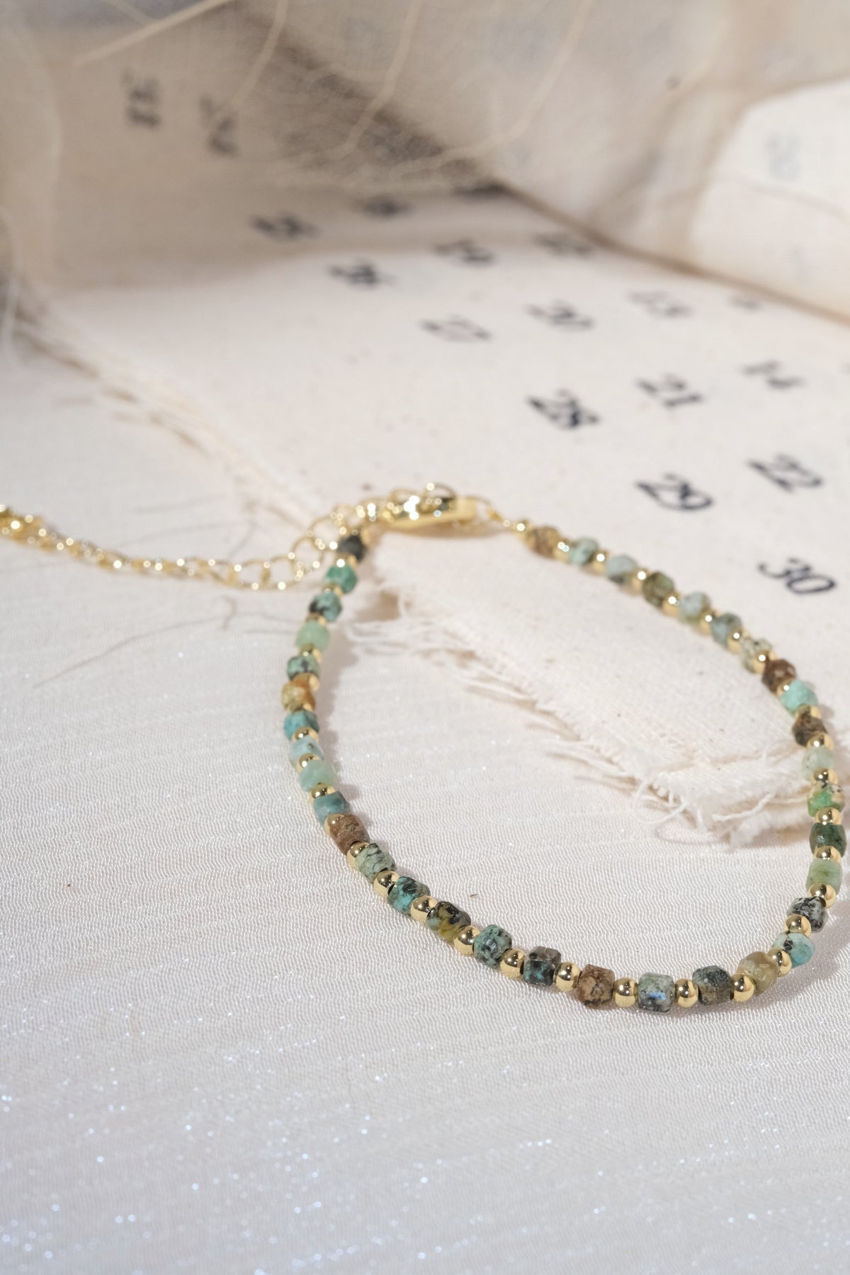 Green Gold Tone Patterned Spacers Bracelet — real product photo