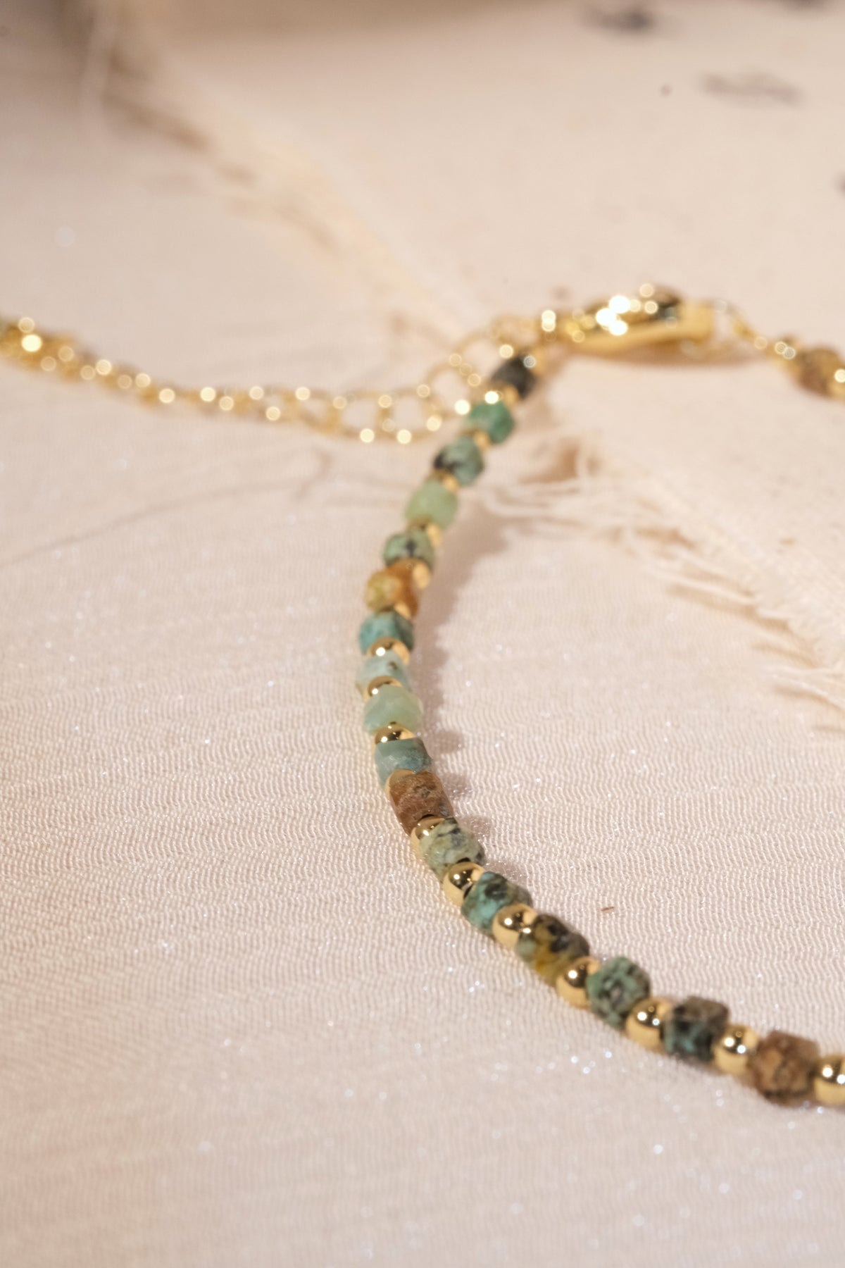 Green Gold Tone Patterned Spacers Bracelet — real product photo