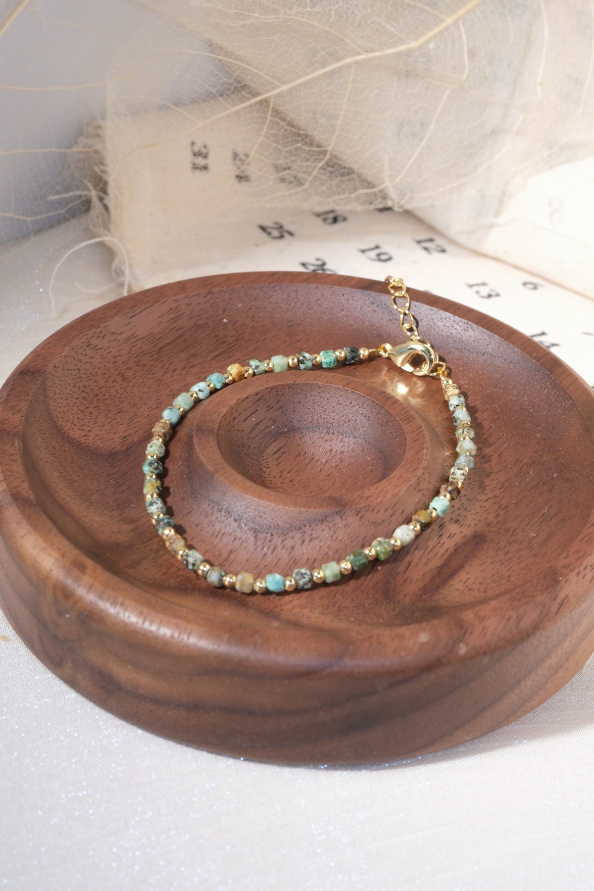 Green Gold Tone Patterned Spacers Bracelet — real product photo