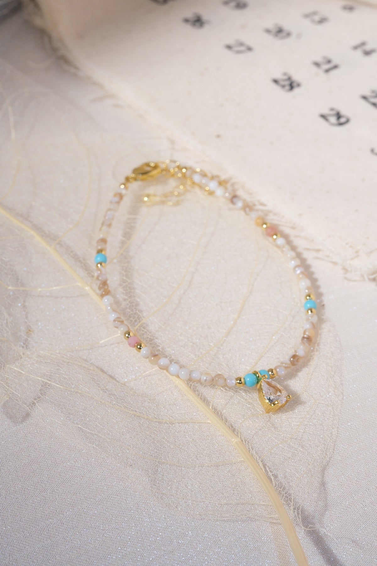 Cream Aqua Teardrop Charm Bracelet — real product photo