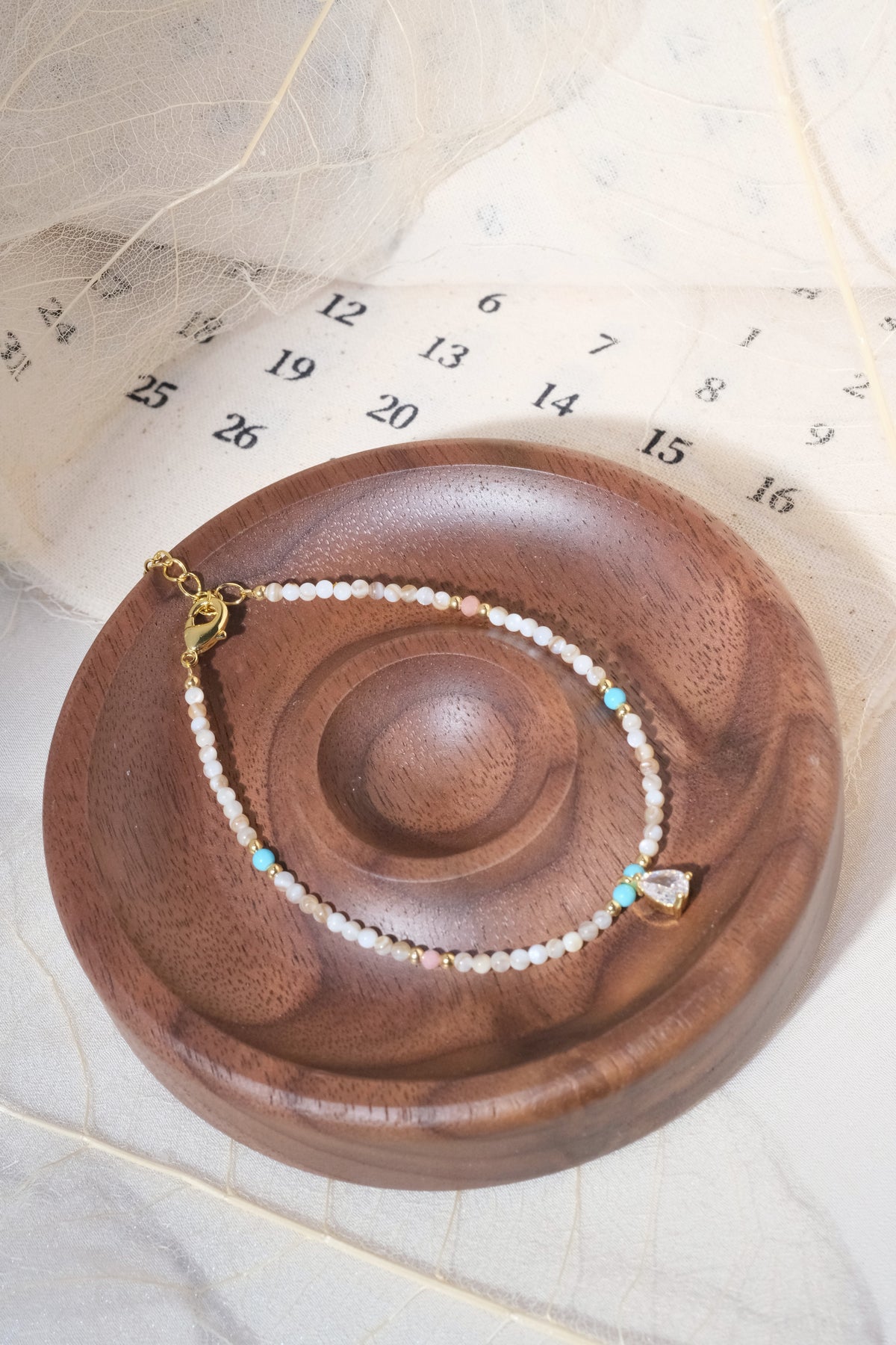 Cream Aqua Teardrop Charm Bracelet — real product photo