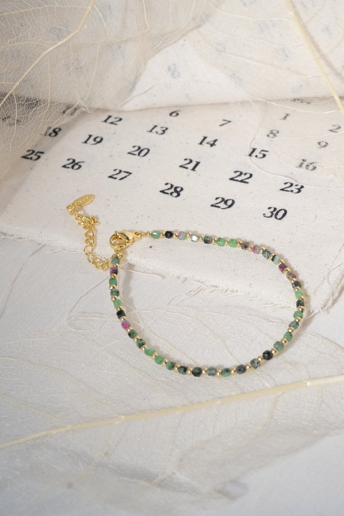 Green Round Gold Tone Spacers Bracelet — real product photo