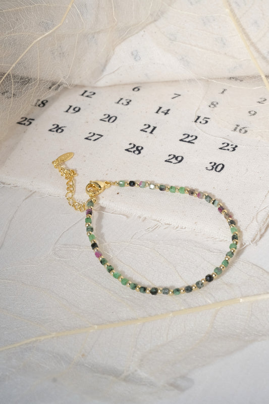 Green Round Gold Tone Spacers Bracelet — real product photo