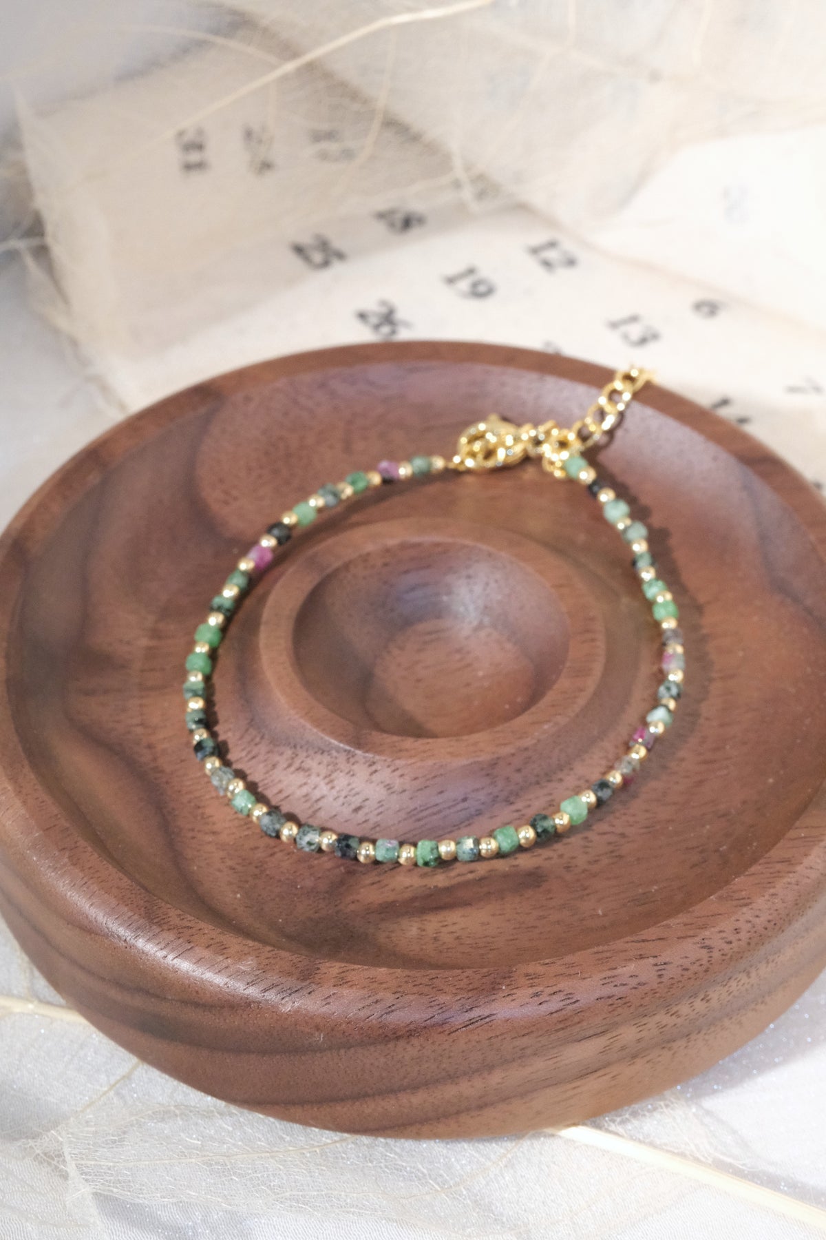 Green Round Gold Tone Spacers Bracelet — real product photo