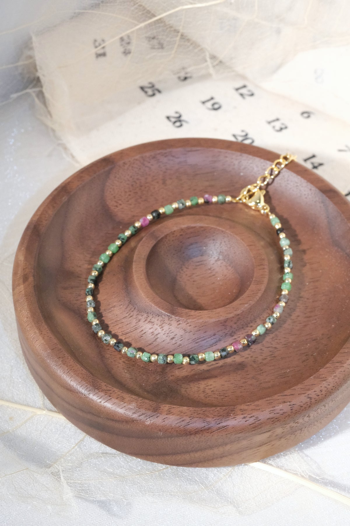 Green Round Gold Tone Spacers Bracelet — real product photo