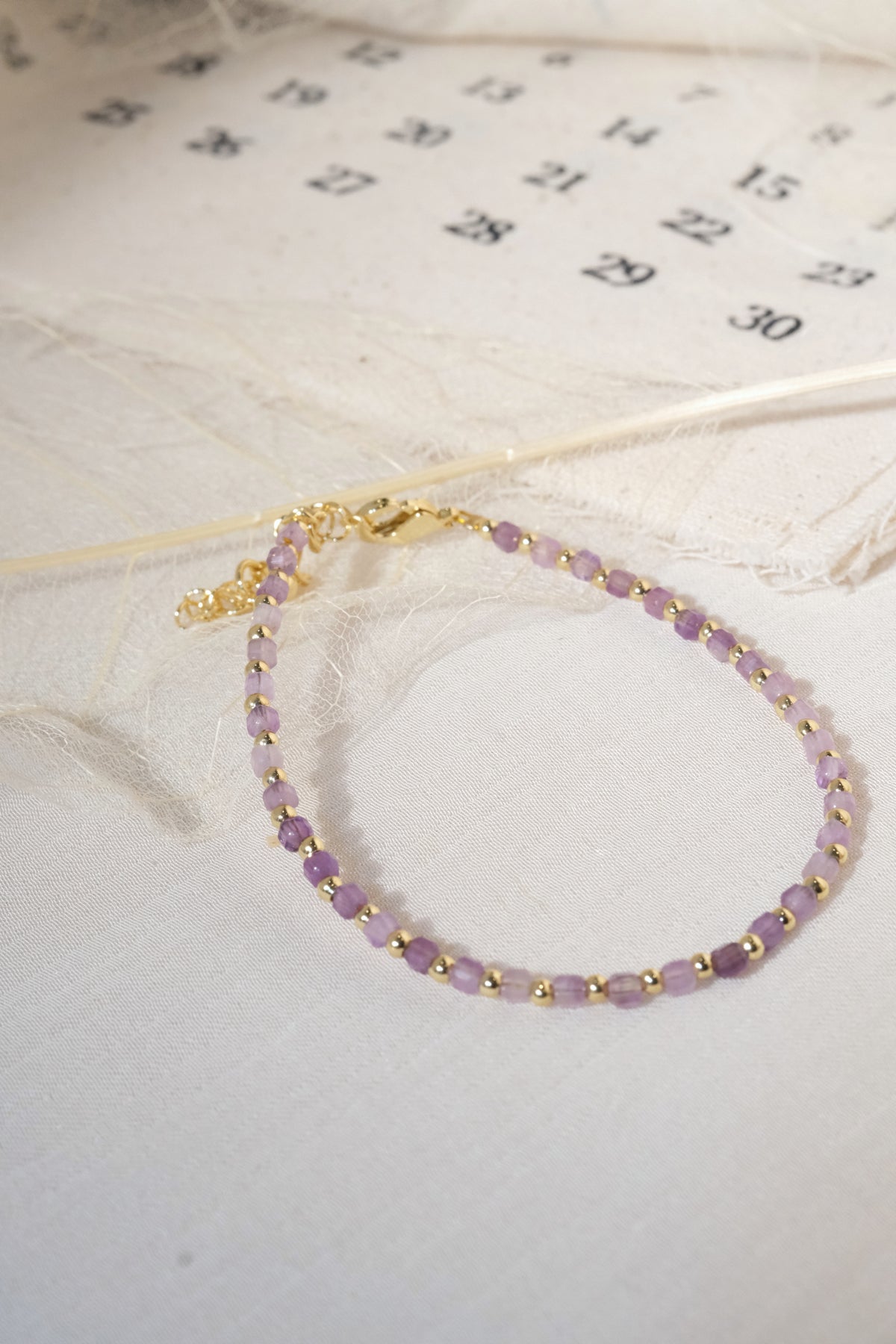 Purple Faceted Gold Tone Spacers Bracelet — real product photo