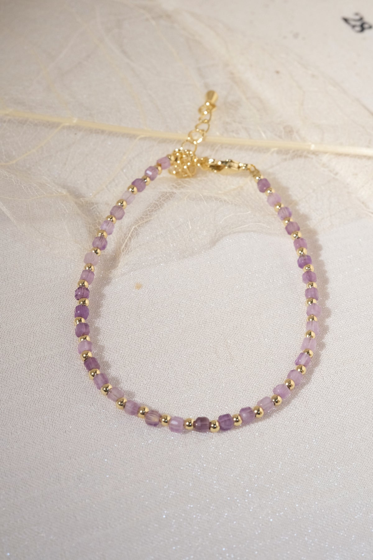Purple Faceted Gold Tone Spacers Bracelet — real product photo