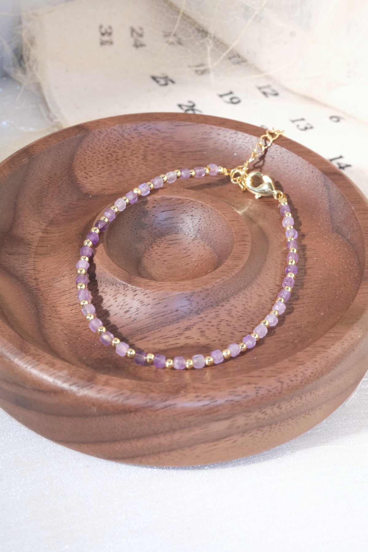 Purple Faceted Gold Tone Spacers Bracelet — real product photo