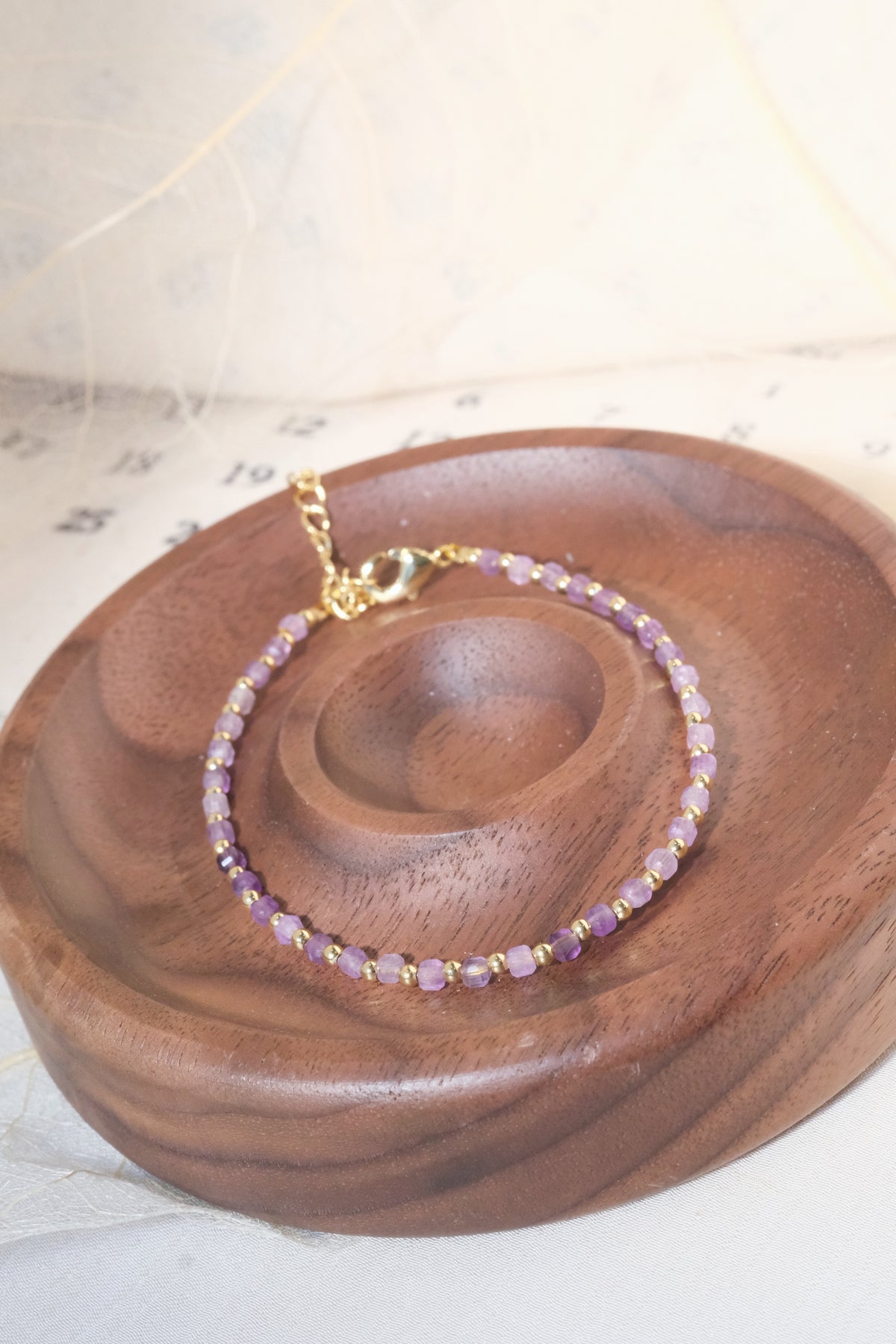 Purple Faceted Gold Tone Spacers Bracelet — real product photo