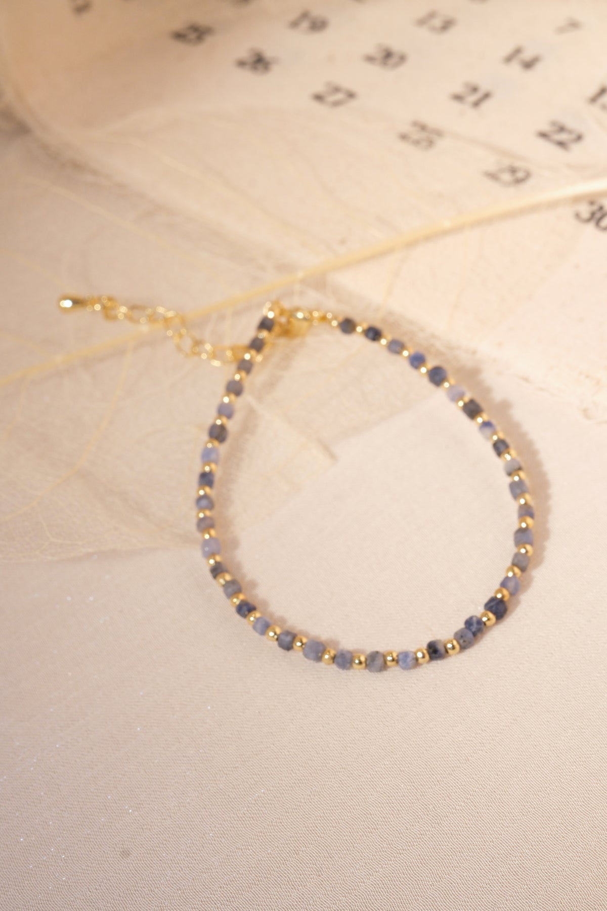 Grey Blue Gold Tone Spacers Bracelet — real product photo