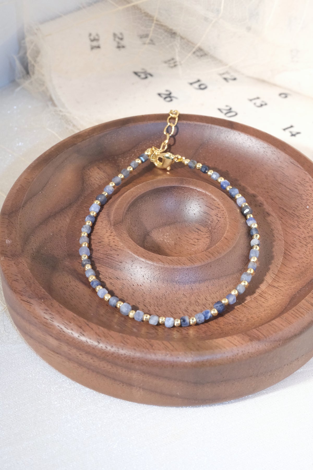 Grey Blue Gold Tone Spacers Bracelet — real product photo