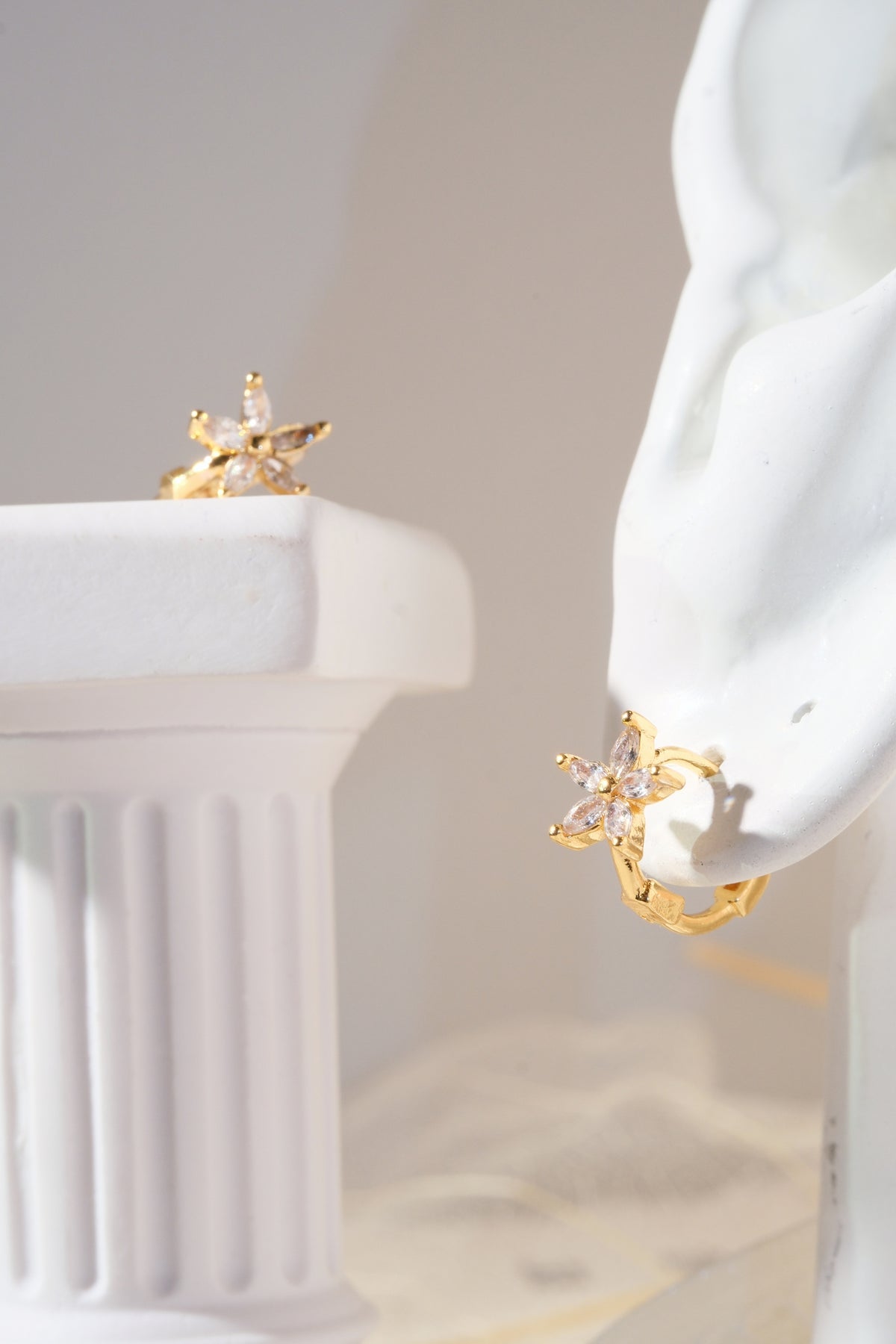 Gold Tone Five Petal Hoops Earrings — real product photo