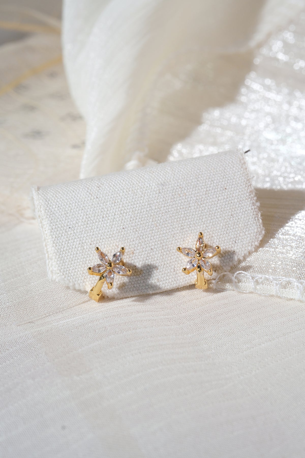 Gold Tone Five Petal Hoops Earrings — real product photo