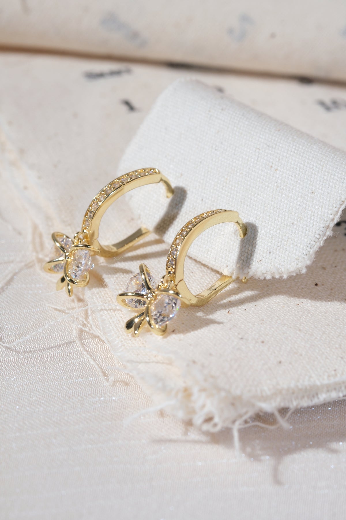 Gold Bow Dangle Hoop Earrings — edited real product photo