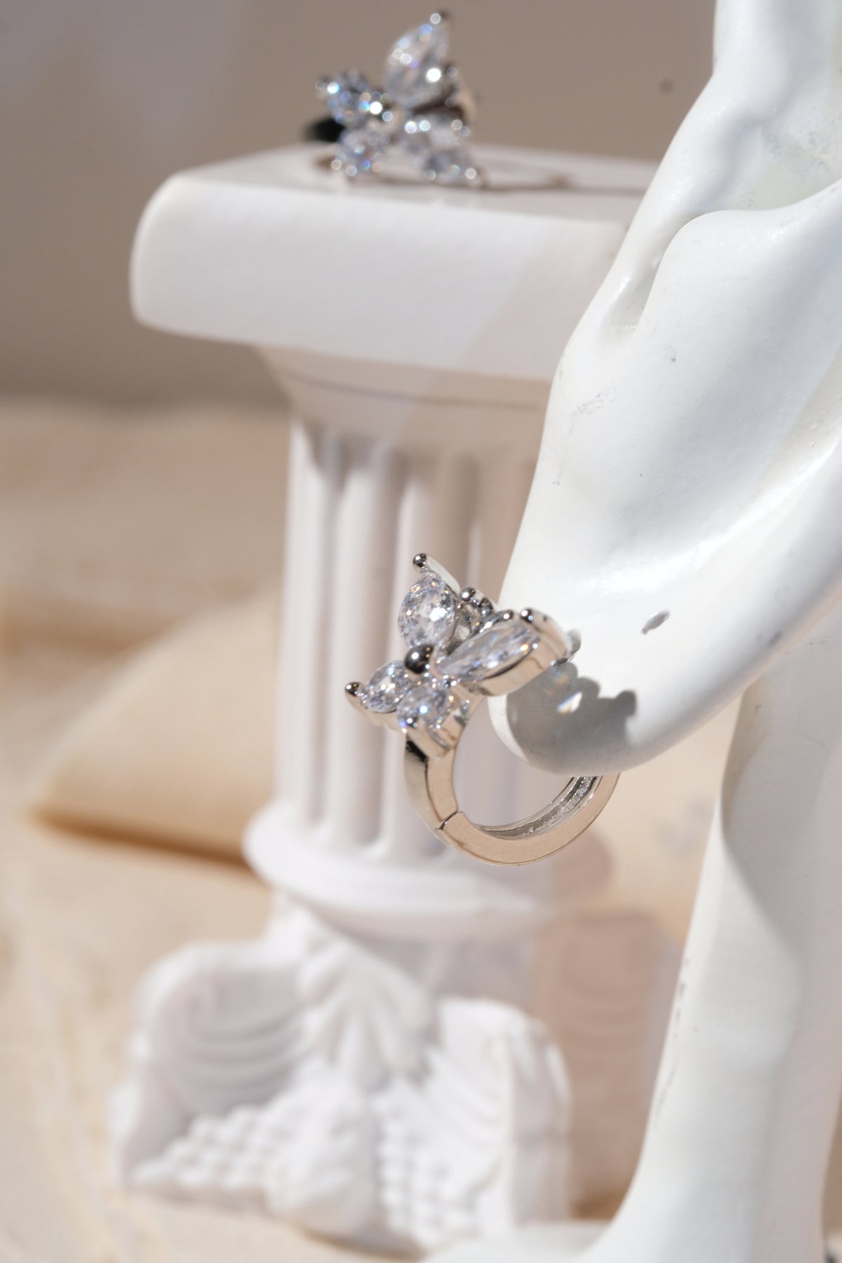 Silver Butterfly CZ Huggie Earrings — edited real product photo