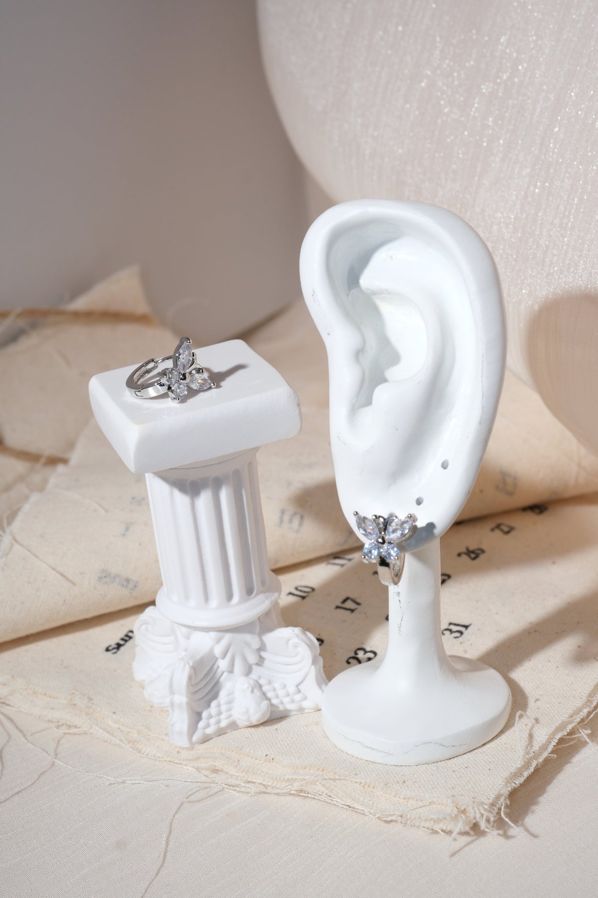 Silver Butterfly CZ Huggie Earrings — edited real product photo