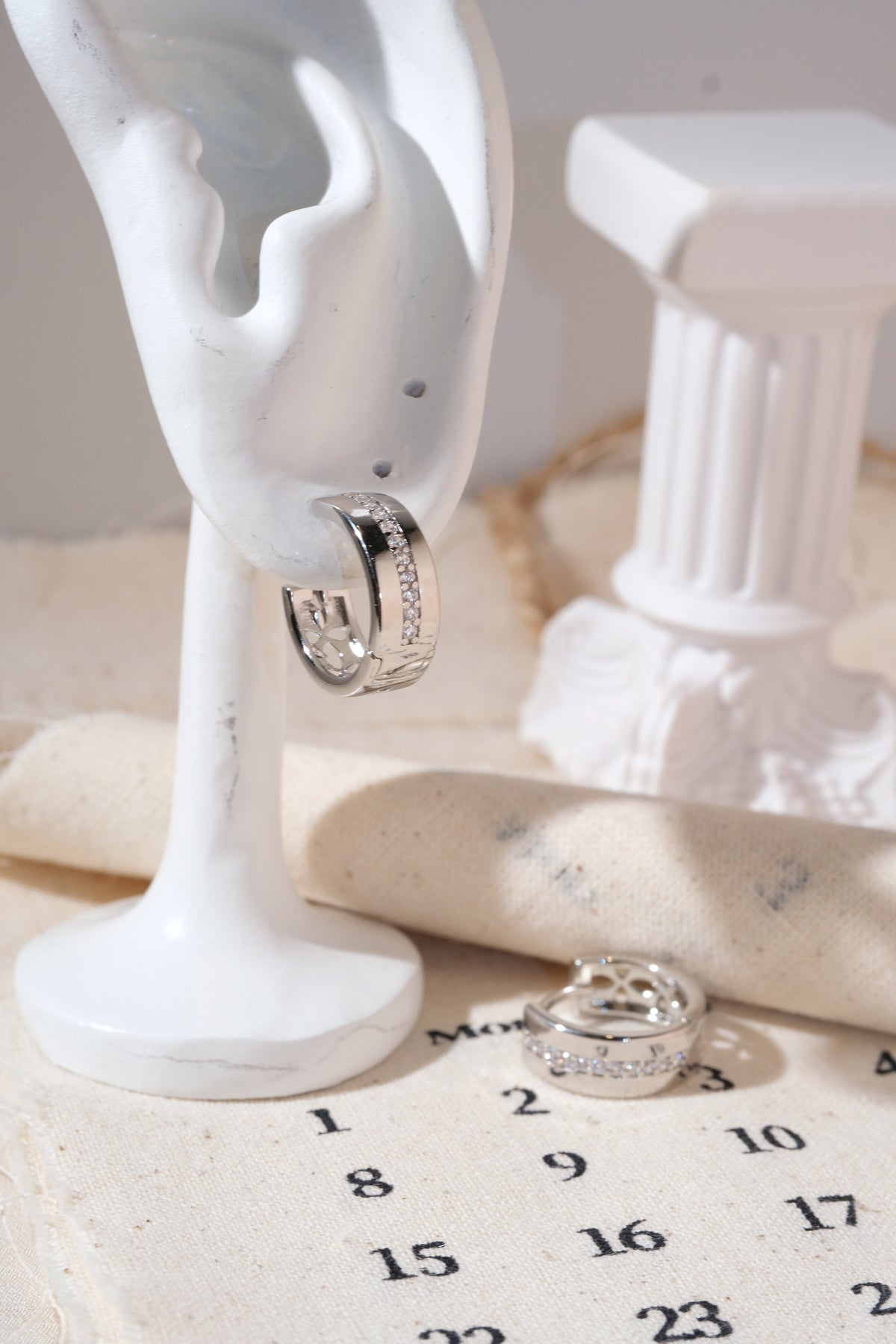Silver Center-Line CZ Huggie Earrings — edited real product photo
