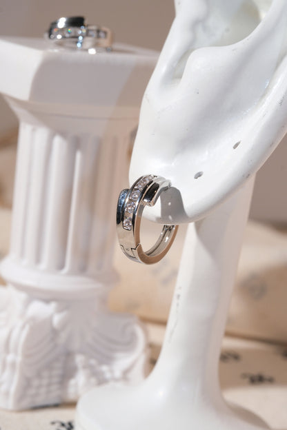 Silver Crossover CZ Huggie Earrings — edited real product photo