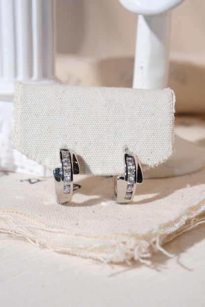 Silver Crossover CZ Huggie Earrings — edited real product photo