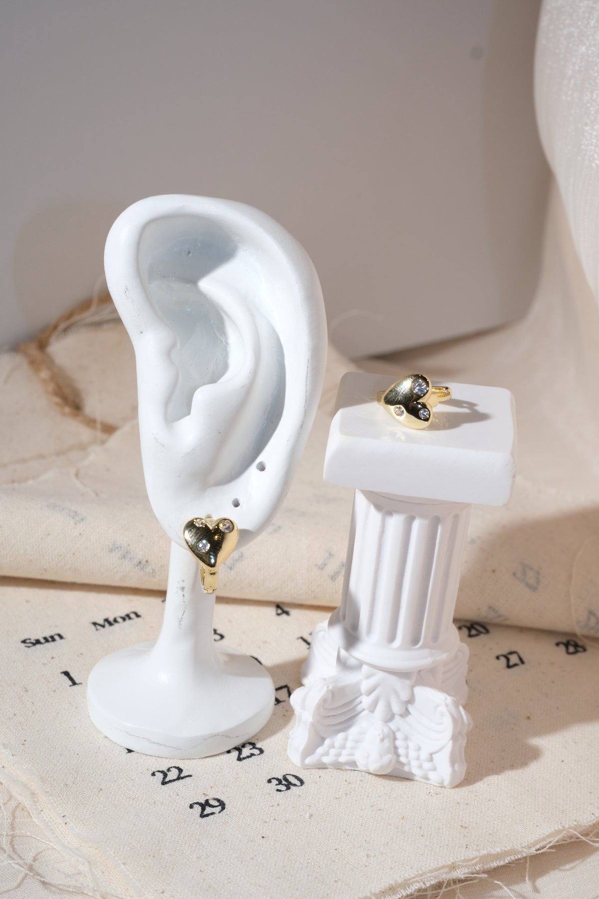 Gold Scattered CZ Heart Huggie Earrings — edited real product photo