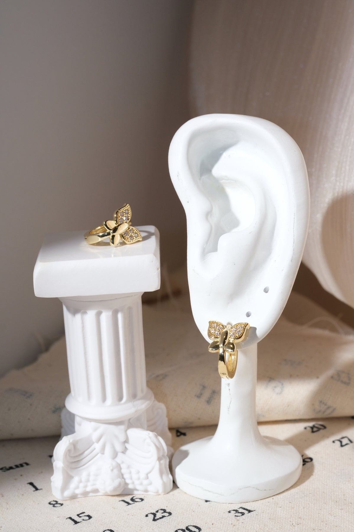 Gold Pave Butterfly Huggie Earrings — edited real product photo