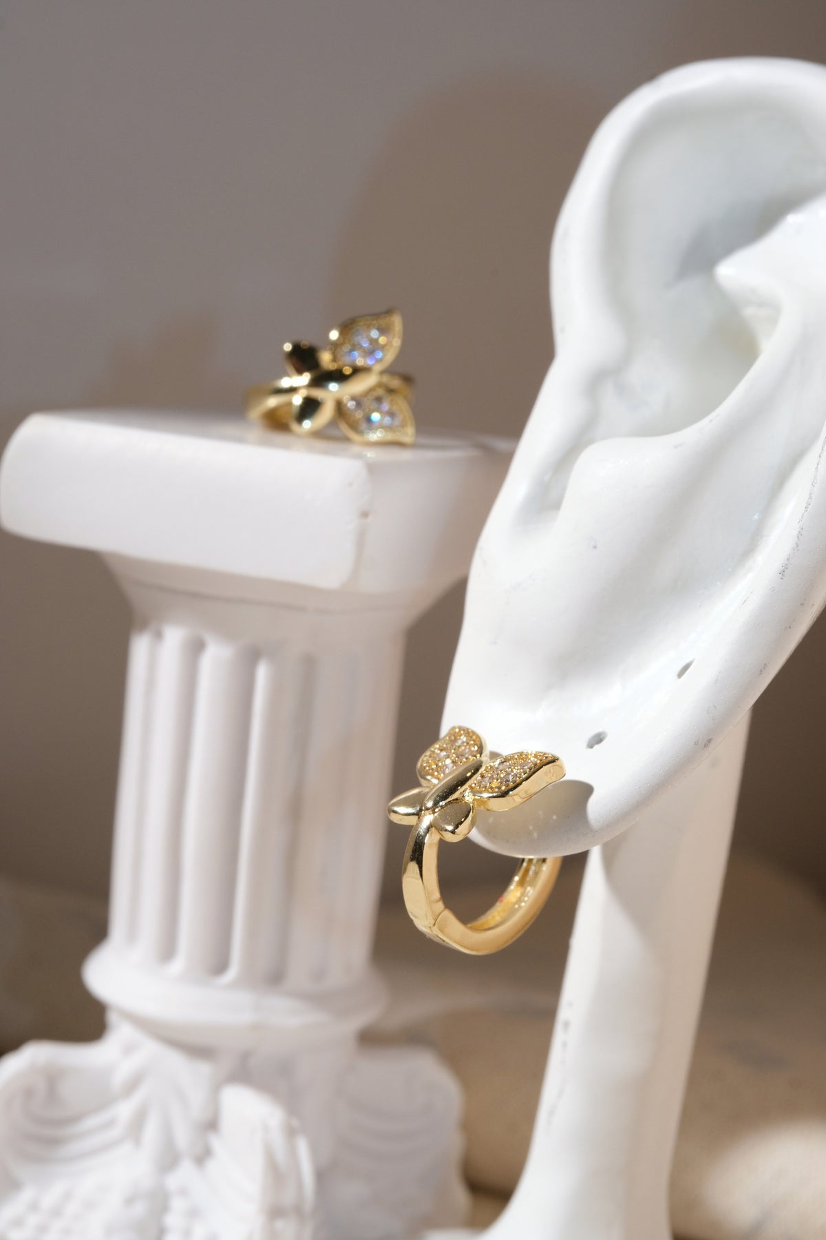 Gold Pave Butterfly Huggie Earrings — edited real product photo