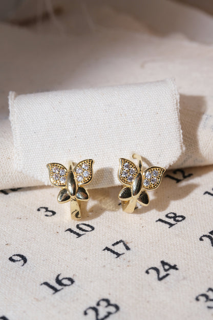 Gold Pave Butterfly Huggie Earrings — edited real product photo