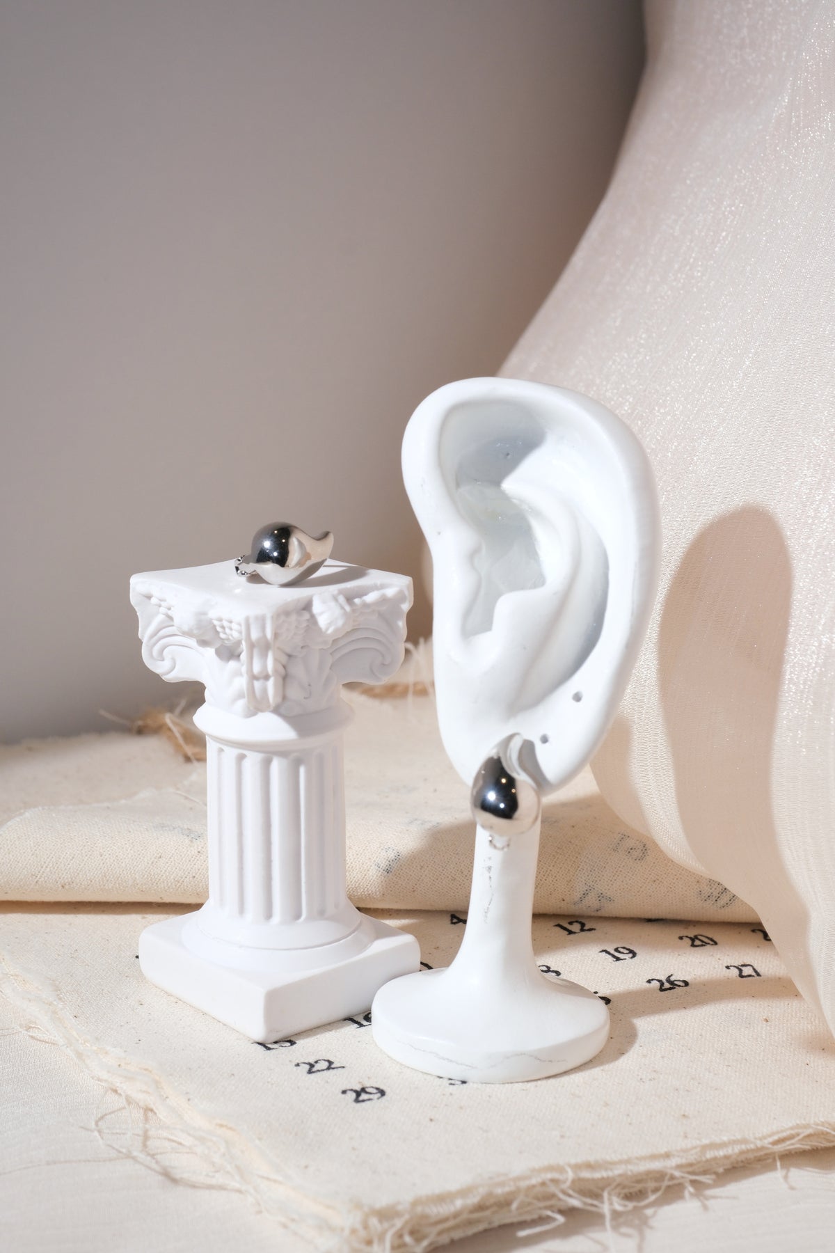 Silver Sculpted Teardrop Earrings — edited real product photo