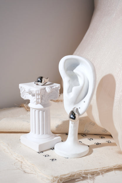 Silver Sculpted Teardrop Earrings — edited real product photo